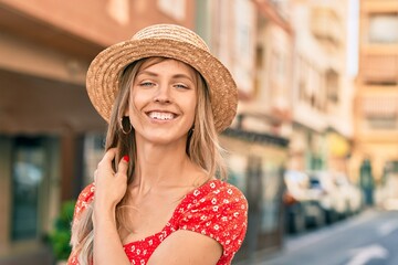 Poster - young blonde tourist woman wearing summer style walking at the city.