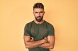 © Krakenimages.com - Young hispanic man wearing casual clothes skeptic and nervous, disapproving expression on face with crossed arms. negative person.