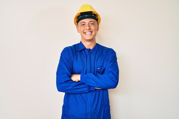 Sticker - Young hispanic boy wearing worker uniform and hardhat happy face smiling with crossed arms looking at the camera. positive person.