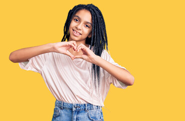 Wall Mural - Cute african american girl wearing casual clothes smiling in love showing heart symbol and shape with hands. romantic concept.