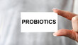 © Veranika - Doctor advises. Medical worker holds PROBIOTICS sign, healthy lifestyle concept.