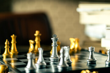 Wall Mural - business strategy metaphor chess board game with abstract blur background