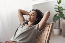 Young Woman Relaxing At Home.  African American Girl Resting In Her Room. Enjoy Life, Rest, Relaxation, Wellbeing, Lifestyle, People, Recreation Comcept