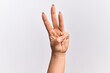 © Krakenimages.com - Hand of caucasian young woman counting number 3 showing three fingers