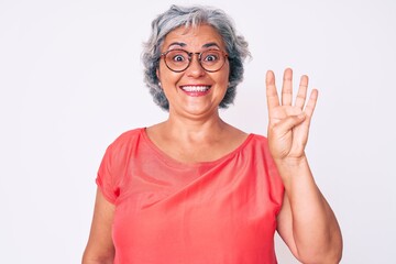 Sticker - Senior hispanic grey- haired woman wearing casual clothes and glasses showing and pointing up with fingers number four while smiling confident and happy.