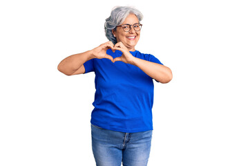 Sticker - Senior woman with gray hair wearing casual clothes and glasses smiling in love showing heart symbol and shape with hands. romantic concept.