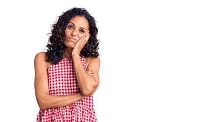 Wall Mural - Middle age beautiful woman wearing casual sleeveless t shirt thinking looking tired and bored with depression problems with crossed arms.