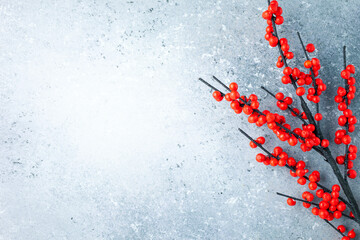Wall Mural - christmas or new year background with red winterberry . branches. winter holiday concept, top view, 