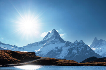 Wall Mural - bachalpsee lake in swiss alps mountains. snowy peaks of wetterhorn, mittelhorn and rosenhorn on back