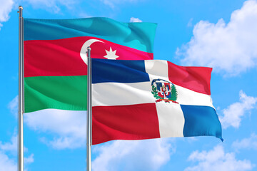 Dominican Republic and Azerbaijan national flag waving in the windy deep blue sky. Diplomacy and international relations concept.