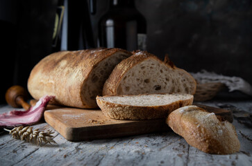 
Fresh bread on a wooden table in rustic style