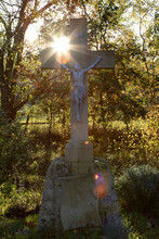 Jesus On The Cross, On A Big Stone, Trees In The Background, Sunbeams
