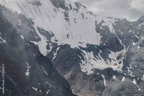 Cuadros en Lienzo Atmospheric minimalist textured alpine landscape with massive hanging glacier on big mountain in low clouds