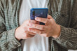 © phpetrunina14 - smiling man portrait using phone