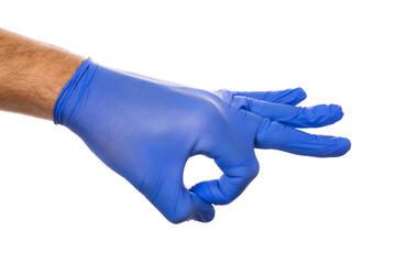 A hand in a medical glove makes a snap of the fingers, isolated on a white background. Finger flick