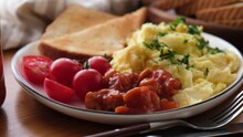 Scrambled Eggs With Baked Beans, Toast And Tomatoes. English Breakfast No Meat Food