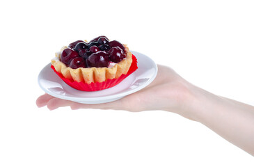 Wall Mural - Cake tart with berries in hand on white background isolation