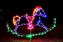 Christmas Rocking Horse Lit Up At Night