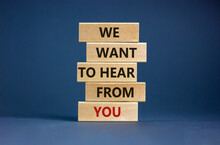Wooden Blocks With Words 'we Want To Hear From You'. Beautiful Grey Background. Copy Space. Business Concept.