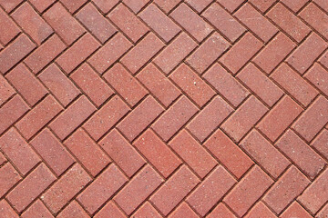 abstract background from paving red tiles, bricks. top view of the pavement pattern. concept for con