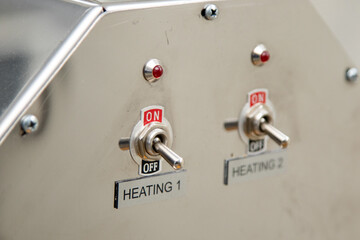 Two power switches for heating and red indicators