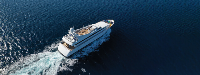Wall Mural - Aerial drone ultra wide panoramic photo of luxury yacht with wooden deck anchored in Mediterranean seascape