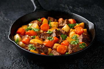 Wall Mural - Beef Stew with carrot and baby potato in iron cast pan