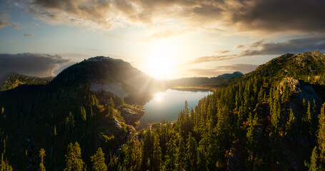 Wall Mural - Aerial Panoramic View of Beautiful Glacier Lake in the Canadian Mountain Landscape. Dramatic Colorful Sunset Art Render. Whistler, British Columbia, Canada. Nature Background Panorama