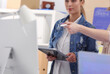 © lenets_tan - Two young woman standing near desk with instruments, plan and laptop.