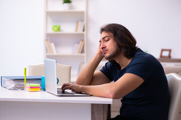 Young man employee working from house