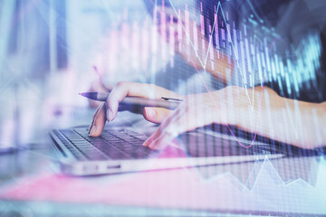 Multi exposure of woman hands typing on computer and financial graph hologram drawing. Stock market analysis concept.