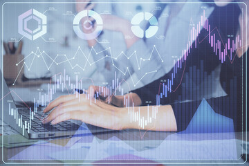 Multi exposure of woman hands typing on computer and financial graph hologram drawing. Stock market analysis concept.