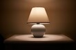 © Gudellaphoto - Small lamp glowing in bedroom night stand, close up, dim room