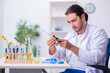 © Elnur - Young male chemist working in the lab