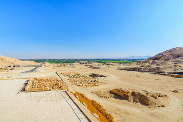 Wall Mural - Archeological site near the temple of Hatshepsut in Luxor, Egypt. Green landscape on a background