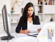 © JackF - Tired businesswoman working with documents in business office