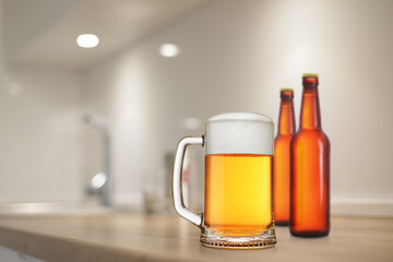 Sticker - Beer stein and brown bottles on the kitchen table.