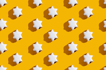 White star pattern. Yellow seamless background. Cute minimalist decor for kids. Modern symmetrical ornament isolated on bright orange.