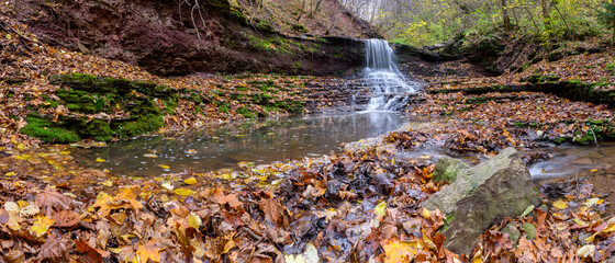 Sticker - Colorful majestic waterfall in national park forest during autumn