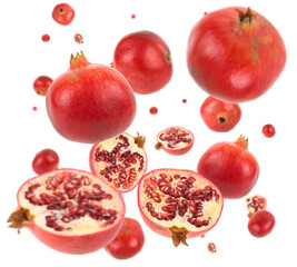 Wall Mural - Many pomegranate apples free falling on white background. Selective focus - shallow depth of field.