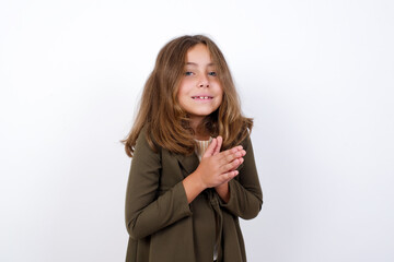 Beautiful little girl standing against white background, , feeling happy, smiling and clapping hands, saying congratulations with an applause.