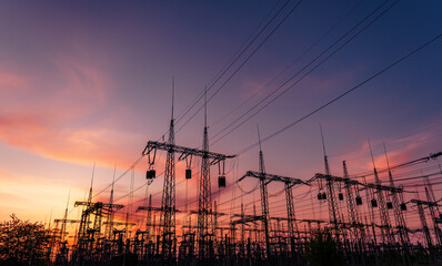 Wall Mural - electrical substation silhouette on the dramatic sunset background