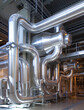 © Mint Images - Industrial Pipes in a Power Plant