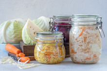Fermented Preserved Vegetarian Food Concept. Cabbage Sauerkraut Sour Glass Jars