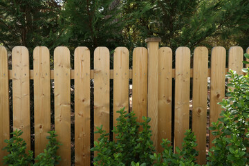 Sticker - Closeup shot of a wooden fence in a garden backyard