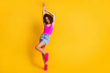 Sticker - Full body photo of attractive wavy hairdo lady hands up summer holidays youth students party wear sun glasses pink tank top denim mini skirt shoes isolated vivid yellow color background