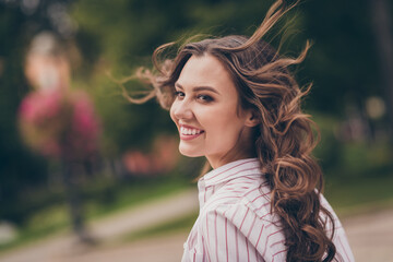 Sticker - Profile photo of adorable optimistic young woman smiling long curly hair walking park wear white striped shirt outdoors