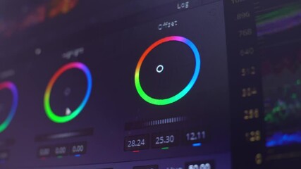 Color correction, color circles in the editing program on the computer display. A professional performs color correction of the video .