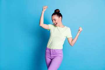 Wall Mural - Photo of delighted girl raise fists scream isolated over blue pastel color background