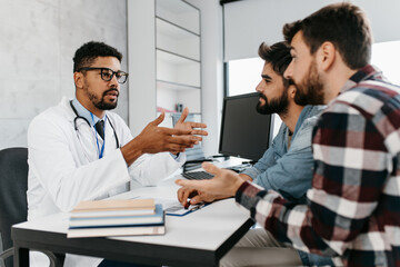 Gay couple together visiting doctor. Homosexuality concept.